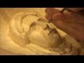 Carving a female face in wood