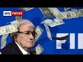 Sepp blatter has money thrown at him by lee nelson