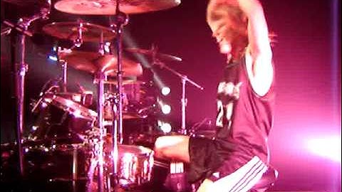 ZOLTAN CHANEY DRUMMER KICKING CRASH CYMBAL