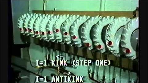 Fluxon motion on Josephson transmission lines modeled on a computer and on long coupled pendulums