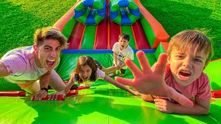 WE PLAY RACES IN GIANT INFLATABLE !!