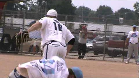 R&M Metals' Kyle Yerkes collides with Resmondo 1st baseman Billy Fulk