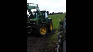 Patterson contracts loading silage round bales