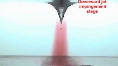 On the transition process of a swirling vortex generated in a rotating tank