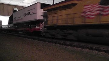 MTH Union Pacific ES44AC leads Atlas O TOFCs in HD
