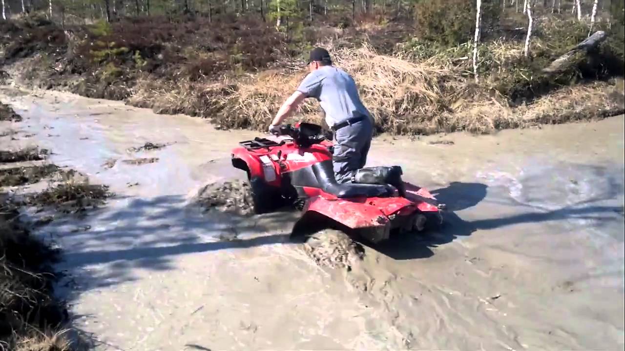 Suzuki King Quad 700 mudding with original tires