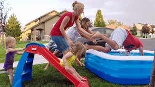 TWO WOMEN THROW GROWN MAN INTO KIDDIE POOL