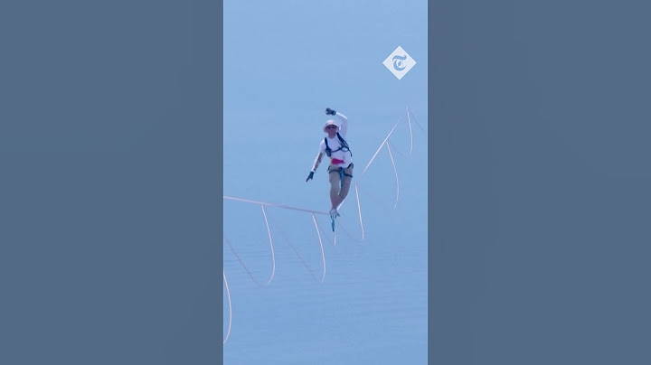 Moment athlete falls off world's longest slackline