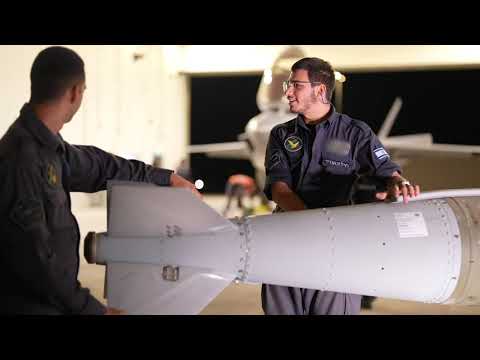 Air Force Commander in conversation with service members