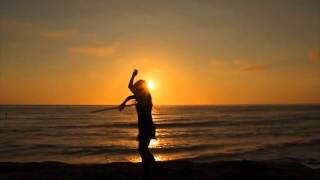 Hula Hoop Dancing at the Beach during Sunset