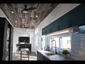 Guesthouse tiny home features reclaimed wood ceiling and incinerating toilet!