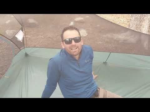 Tom in tent hiding from the mosquitos