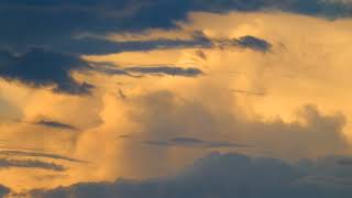 A time lapse in Arizona of orange clouds looking north as the sun sets to the west