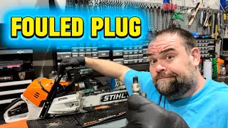 Stihl MS 500i fuel injected chainsaw won’t start because of bad spark plug. Saw smokes when running.