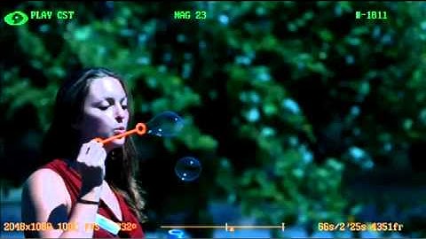 Woman Blowing Bubbles in Slow Motion