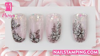 Floral nail art on a sparkling glitter ombre base (nailstamping.com)