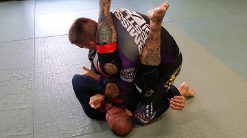 Sweep to armbar from stack defense