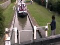 Narrow boats using canal lock.