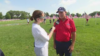 Ana speaks with Rudy Keller while Madeline Dattulo sings 'God Bless America'
