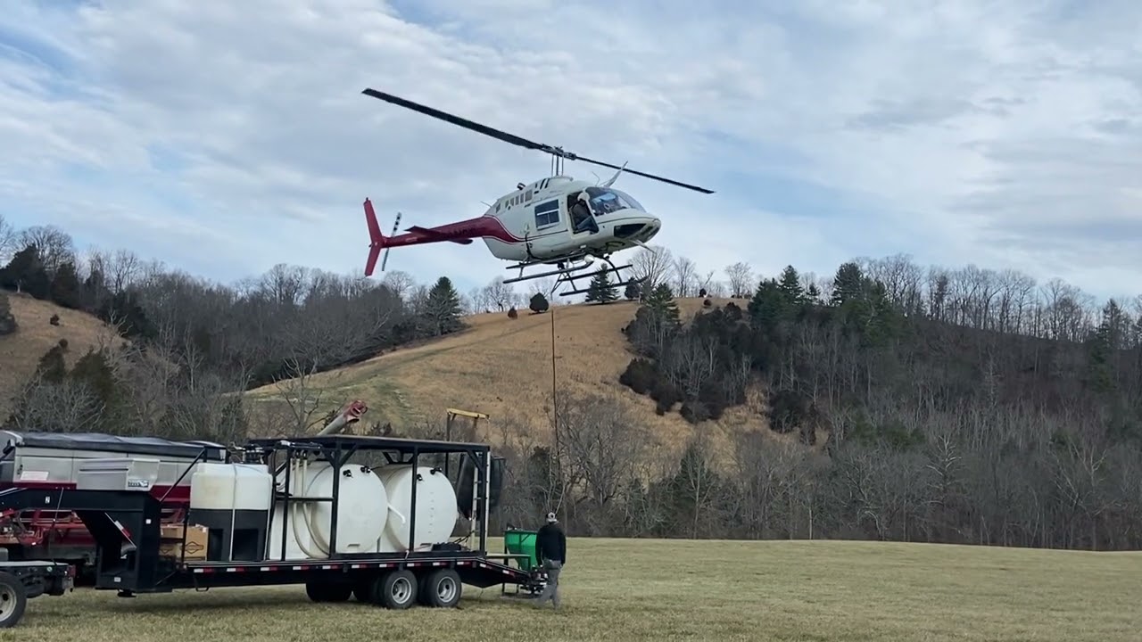 Spreading fertilizer with a Bell 206 helicopter