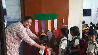 Teacher greeting her class with special handshakes \& hugs before class!!