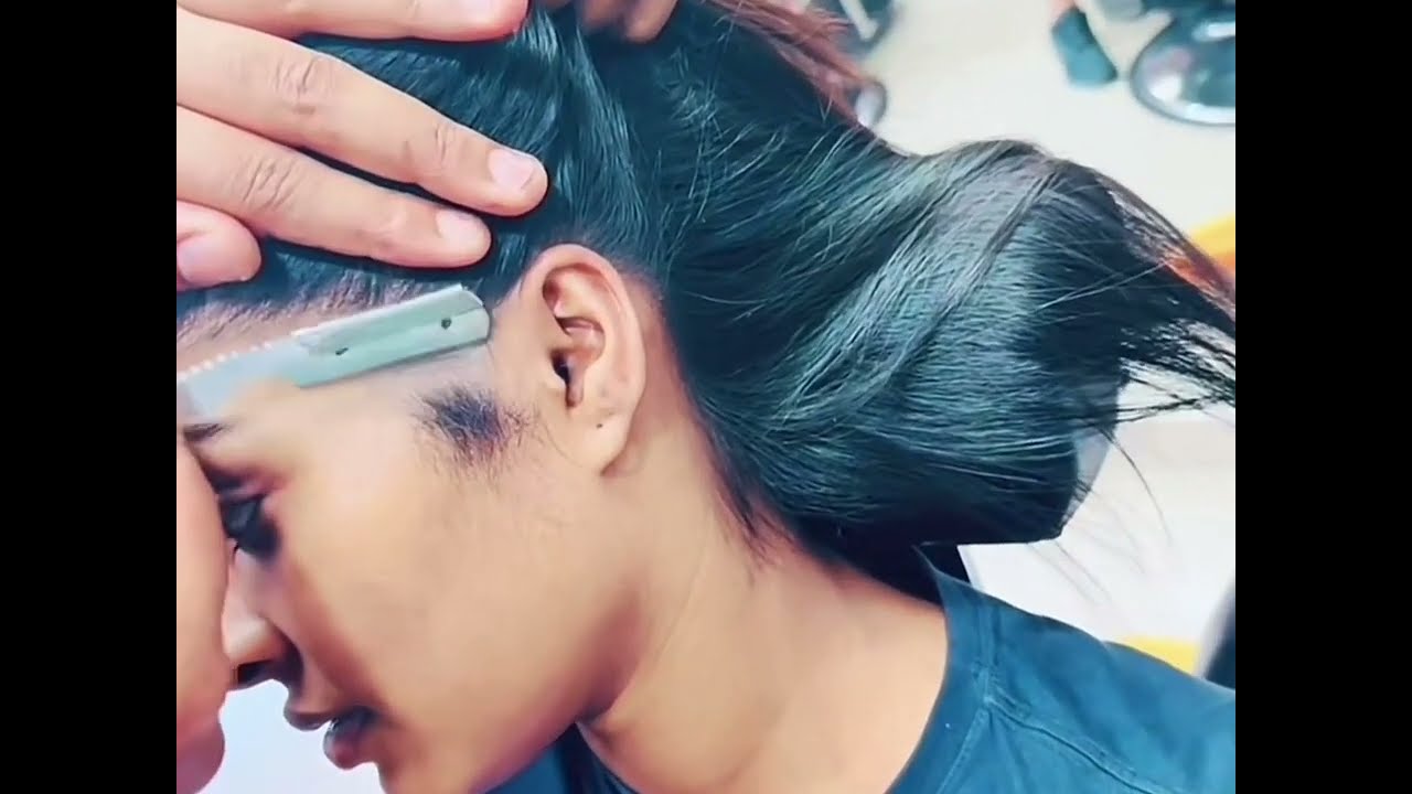 Girl face shave in Barbershop with Razor - 