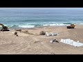 Tons of squid removed from fishing boat stuck on Point Reyes beach