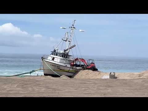 Tons of squid removed from fishing boat stuck on Point Reyes beach