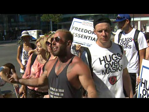 Demonstrators in Toronto refuse to wear masks, board TTC