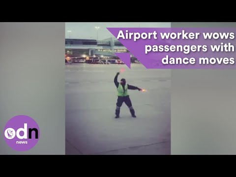 Hilarious airport worker wows passengers with dance moves