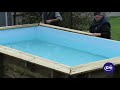 Montaje de una piscina de madera rectangular gre