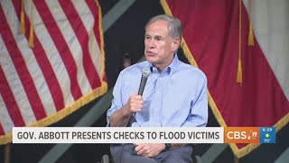 Gov. Abbott presents checks to flood victims Gov Abbott Hands Out Checks To Flood Victims