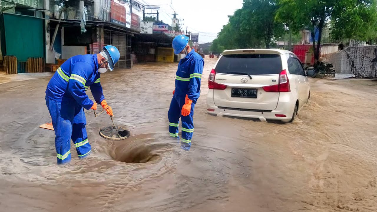 Clearing the Storm Drain That Caused a Massive Street Flood - YouTube