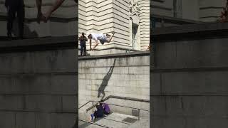 Guy jumps from steps to pillar and faceplants (parkour)
