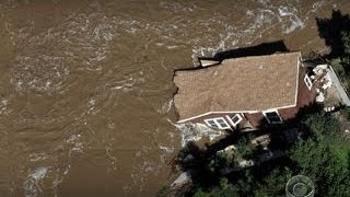 As waters recede in Colo., residents return to assess the damage