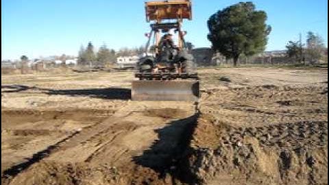 Skiploader Grader at Work with Patrick Juback