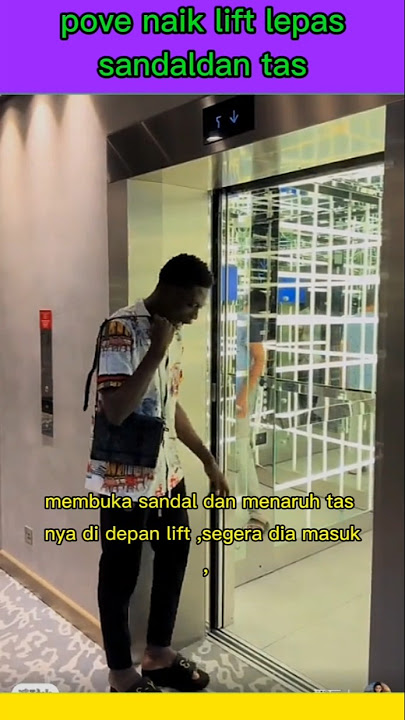 Naik lift lepas sandal dan tas