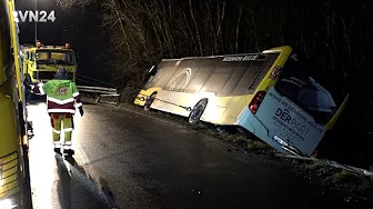 VN24 - Two tow trucks pulled overturned bus back onto the road