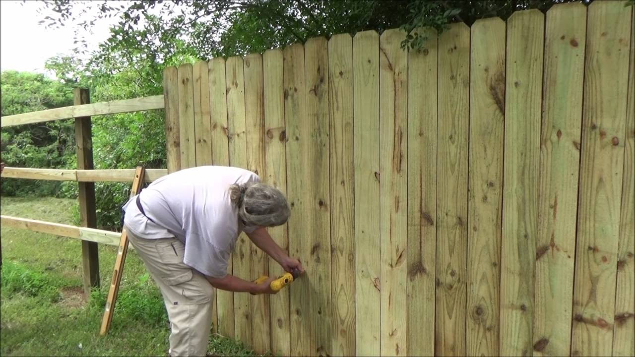 Wood privacy fence picket installation - YouTube
