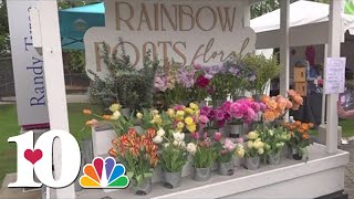 Katie Inman smelling the flowers at Dogwood Arts Festival