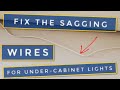 How to keep the wires for IKEA lights in place behind the cabinets.