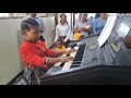 Little girl playing organ