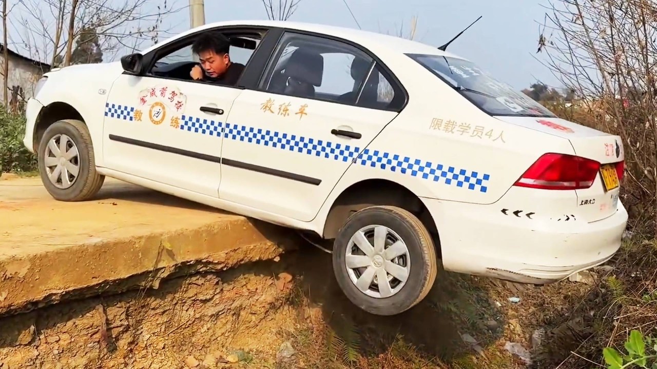 How Do I Get My Car Out If Both Rear Wheels Fall Off The Curb While Reversing?