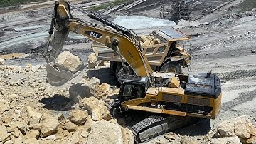 Caterpillar 385C Excavator Loading Caterpillar 775D Dumper And Trucks - Pyramis Ate