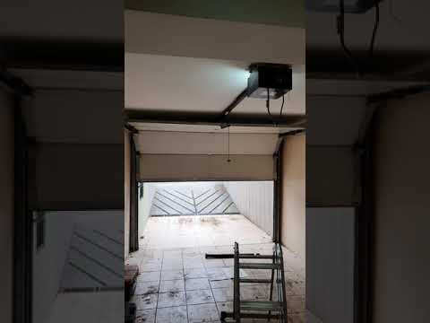 Video: Bir garaj kapısını burulma yayı ile nasıl dengelersiniz?