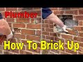 How To Replace Bricks In A Wall - Plumber Bricking Up An Old Flue Hole