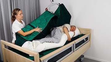 Immedia 4WayGlide – Turning distressed user on side with cushion and hoist