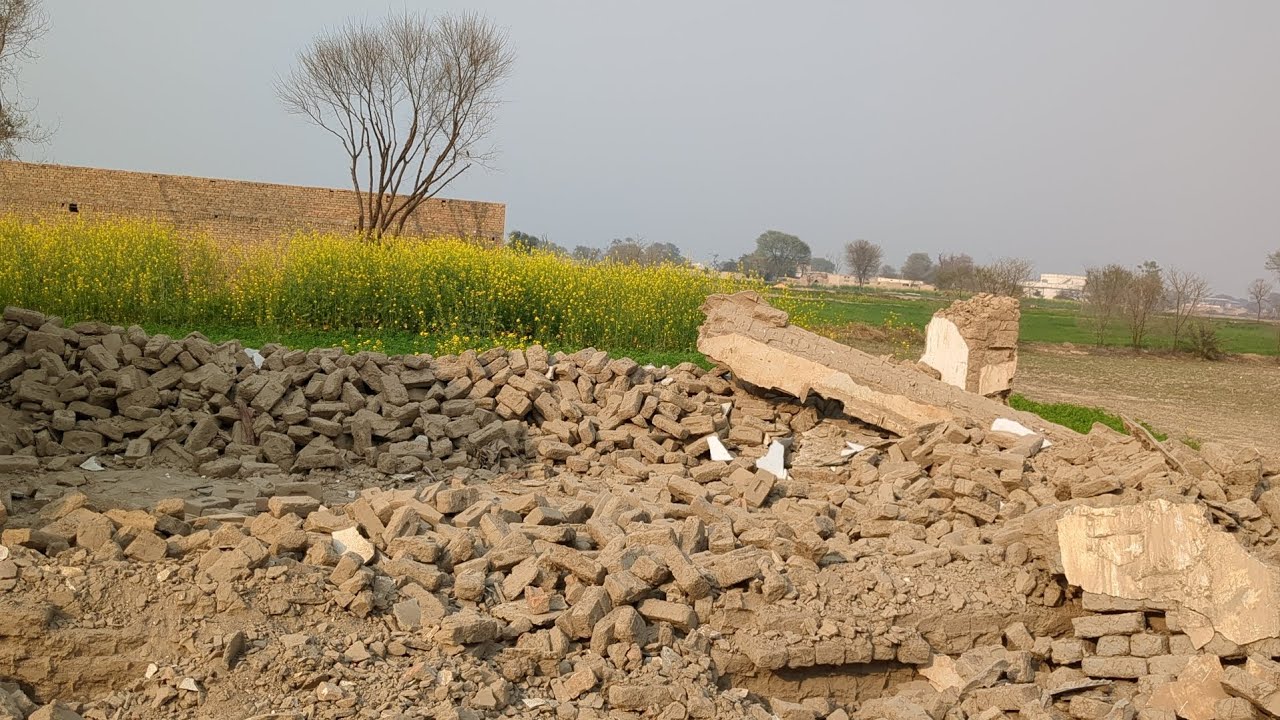 The tractor is pulling the muddy trolley 