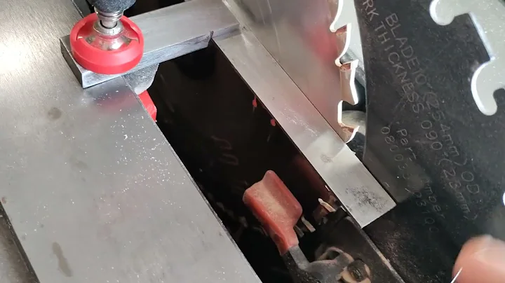 Adjusting the riving knife on a Ridgid R4512 table saw.