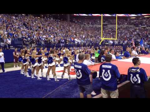 Colts Cheerleaders sing the National Anthem.